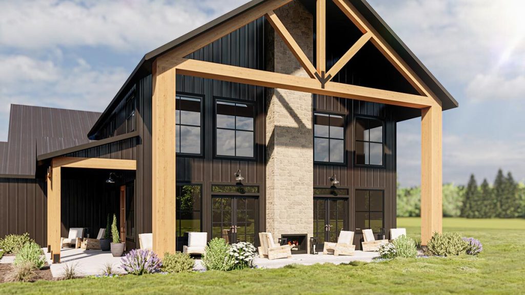 Angled front view of the enchanting loft barndominium with a outdoor fireplace 