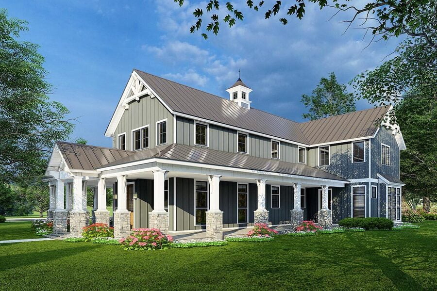 Angled right view of the American Country Style Barndominium with a wrap-around porch