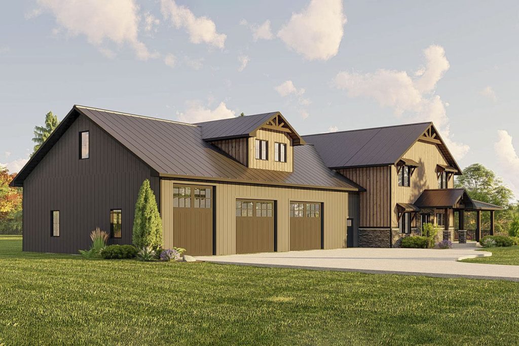 Angled view of the Dreamy Hill Barndominium, highlighting the garage doors and pathway