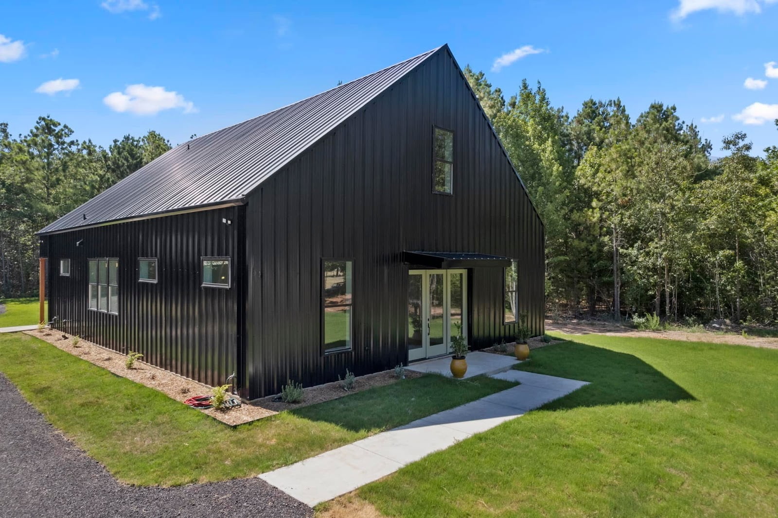 All Black Minimalist Barndo. Image via Barndominium Living Facebook group by Elliot L.