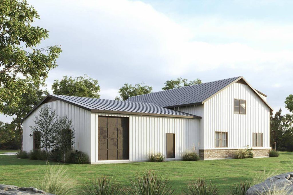 A rear view of this stylish 3-bedroom modern barndominium, offering a perspective of the structure from the back. This view provides an overview of the design and architectural elements that contribute to the appeal of the barndominium's rear elevation.