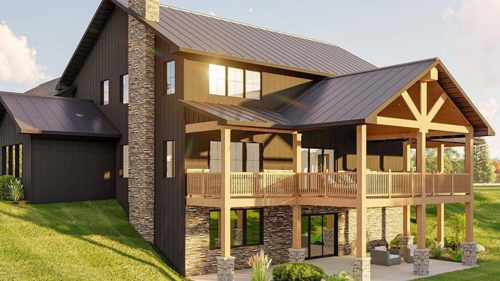 A detailed close-up of the rear exterior view of the barndominium, drawing attention to the charming, covered deck and the adjacent patio. This view allows for an intimate exploration of the inviting outdoor spaces that enhance the living experience of this beautiful structure.