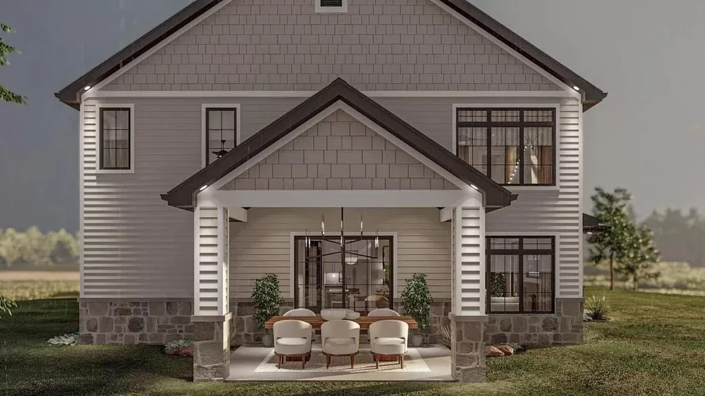 Front view of this shouse barndominium showcasing the main entrance and outdoor seating