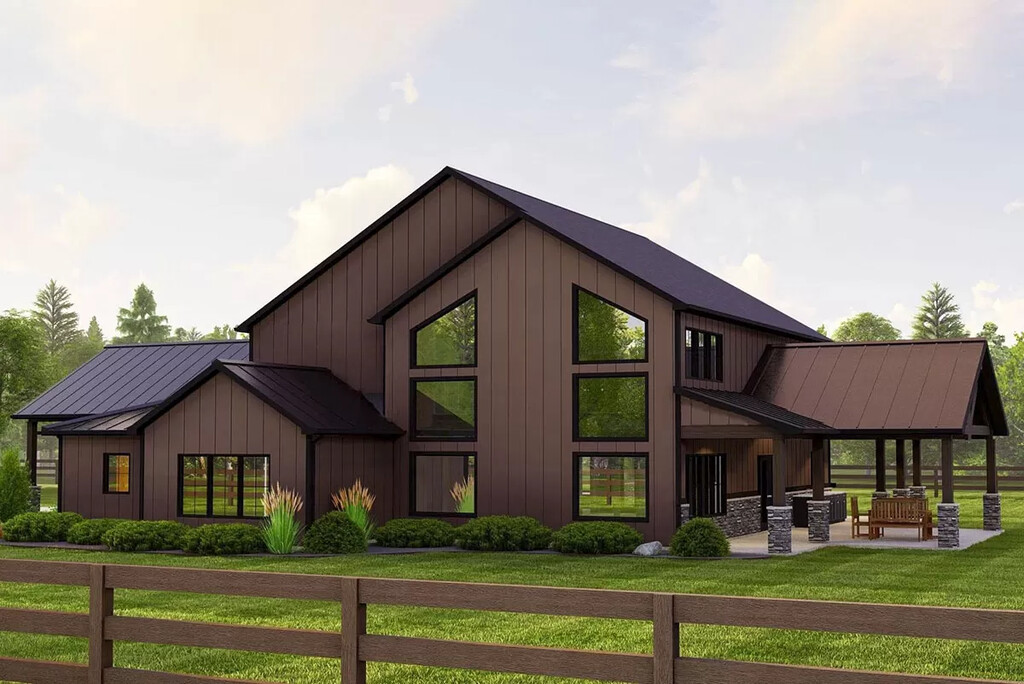 Left side view of  this stunning country-style barndominium showcasing main entrance and front porch