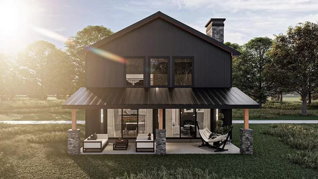 Front view of this loft barndominium showcasing the front entrance and front porch